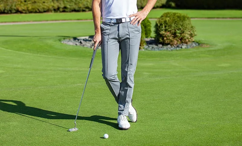 Tailored golf pants paired with belt and golf shoes for a proper course look. Tailored golf pants paired with belt and golf shoes for a proper course look.