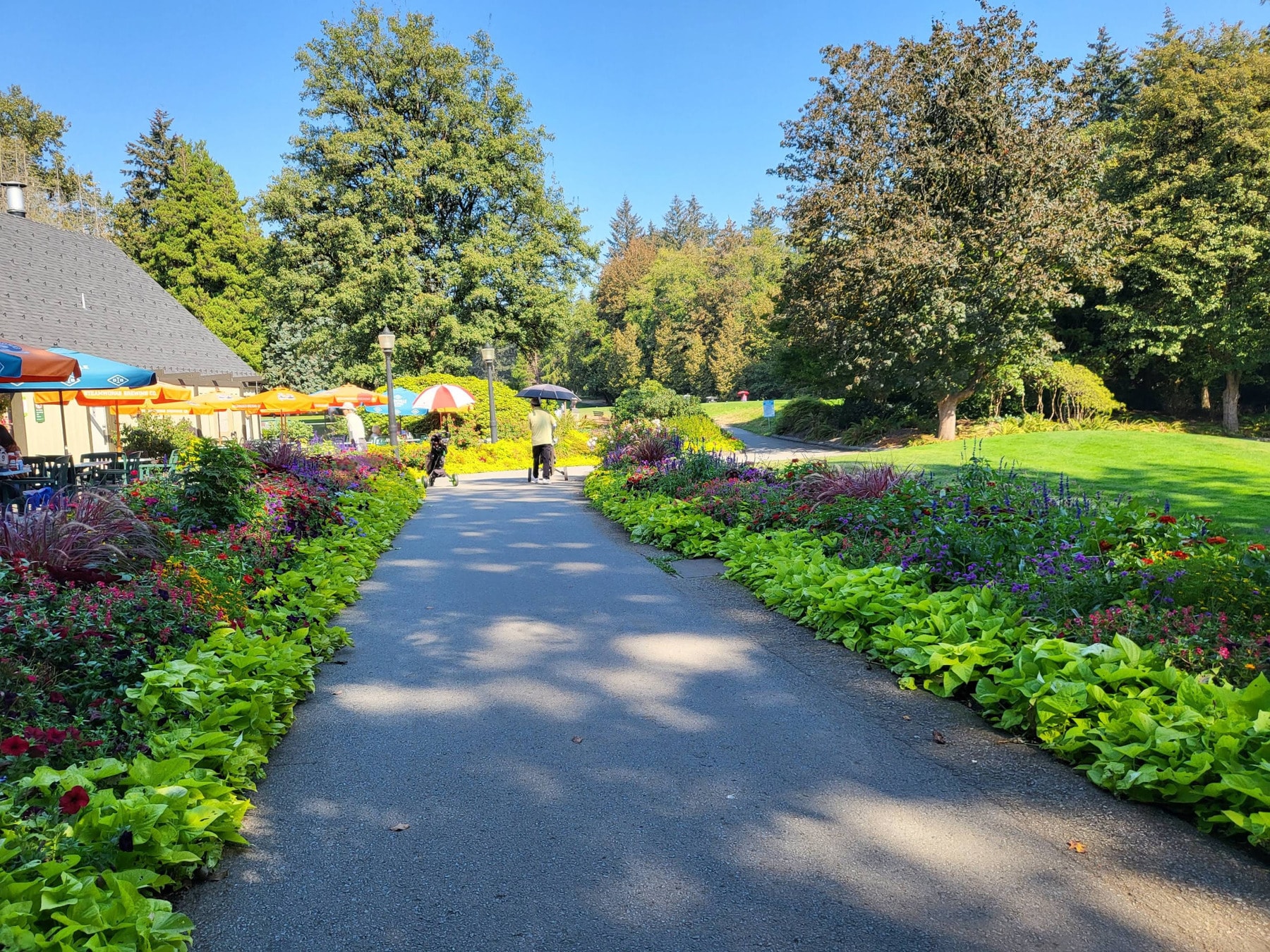 A colorful path near the clubhouse at Fraserview-perfect for a relaxing stroll or post-round coffee under the umbrellas. A colorful path near the clubhouse at Fraserview-perfect for a relaxing stroll or post-round coffee under the umbrellas.