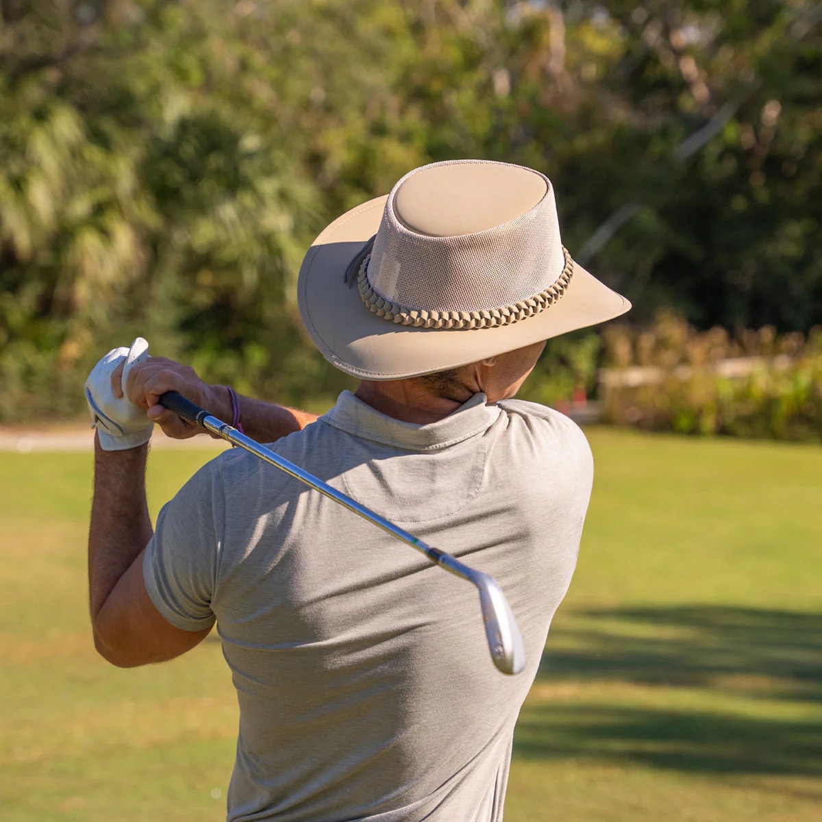 A wide-brim golf hat offers excellent sun protection and keeps you cool during long rounds. A wide-brim golf hat offers excellent sun protection and keeps you cool during long rounds.