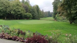 Lush greenery and vibrant flowers surround the putting green at Fraserview-serene and scenic for every round.