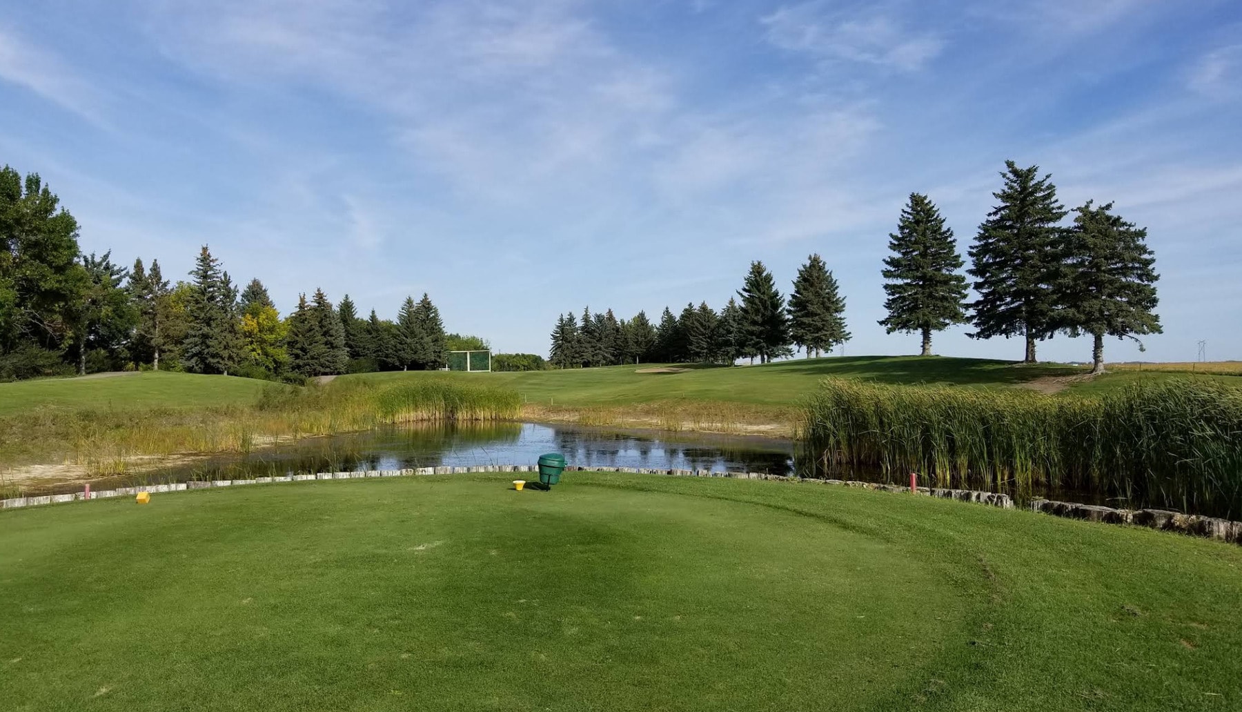 A peaceful hole framed by water and evergreens at Tor Hill Golf Course in Regina’s King’s Park. A peaceful hole framed by water and evergreens at Tor Hill Golf Course in Regina’s King’s Park.
