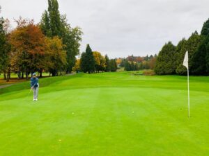 Autumn golf at McCleery — vibrant colors, smooth greens, and a quiet moment to line up your putt.