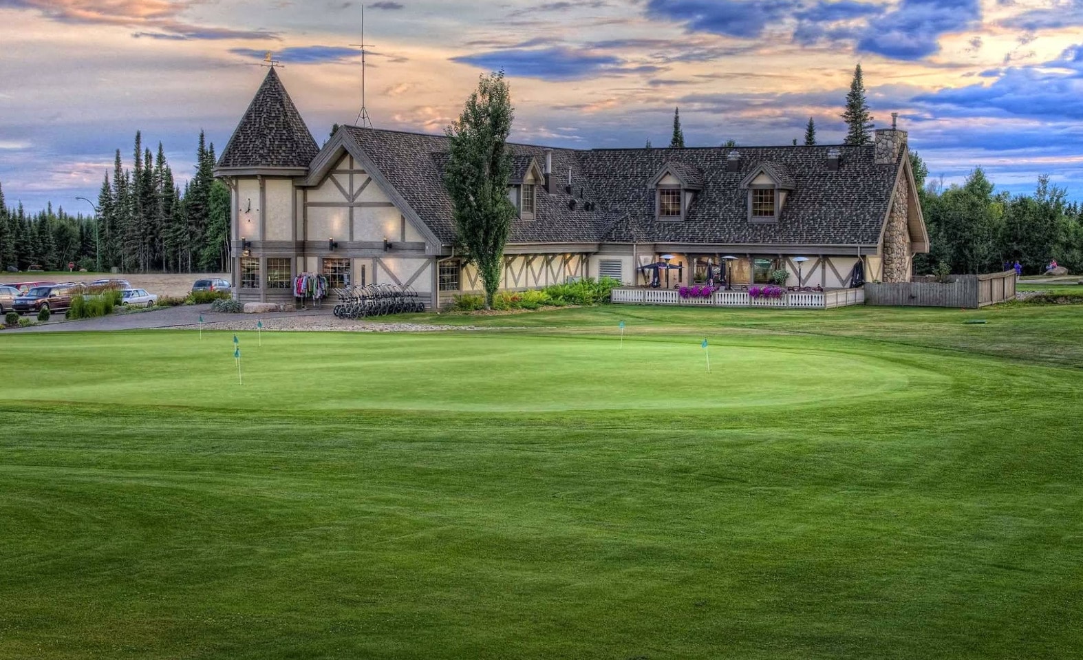 Evening light over the charming clubhouse at Elk Ridge Resort, a premier golf and getaway destination near Waskesiu Lake. Evening light over the charming clubhouse at Elk Ridge Resort, a premier golf and getaway destination near Waskesiu Lake.