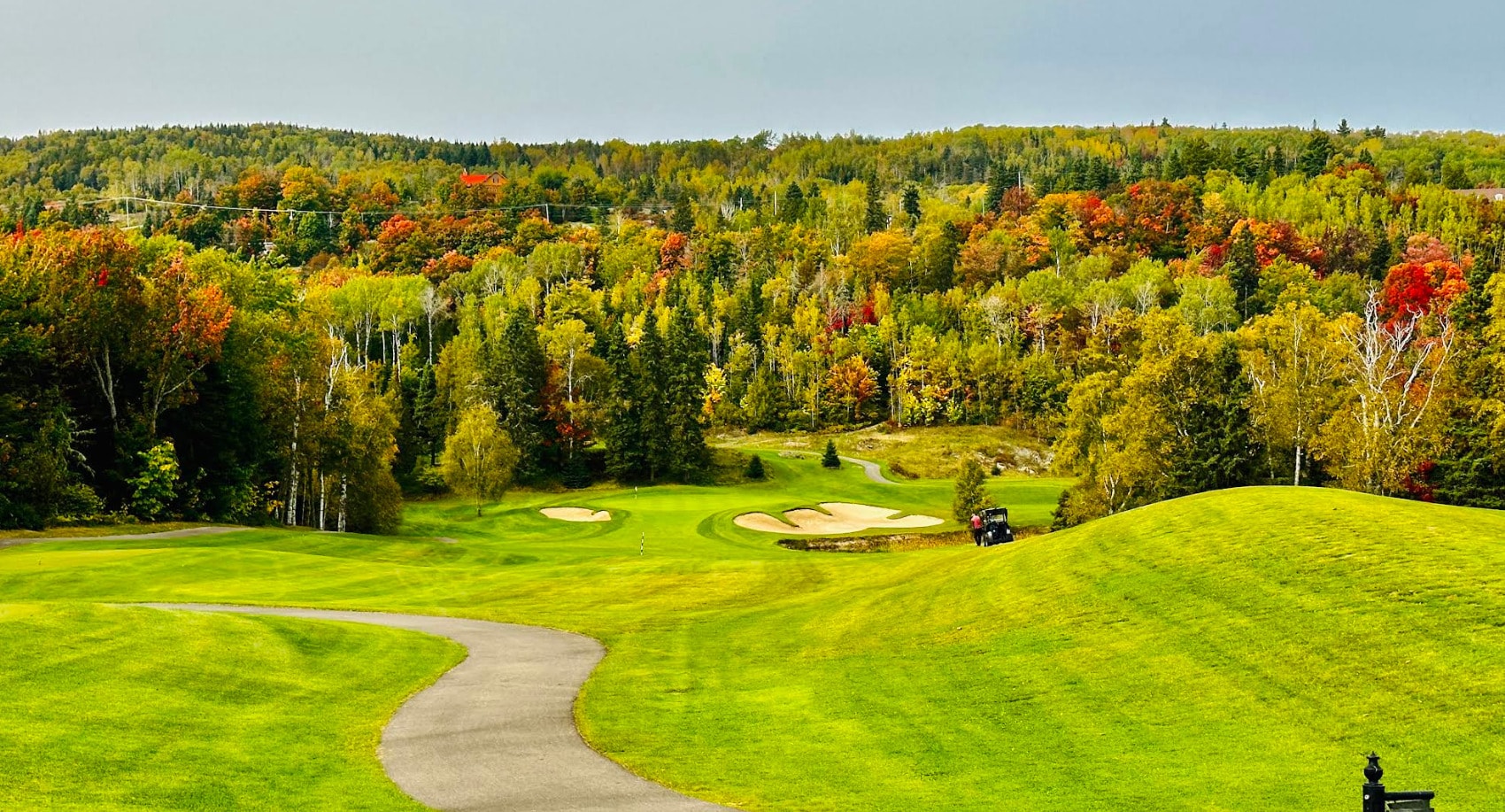 Fairmont Le Manoir Richelieu Golf Club set against the Charlevoix hills, where lush fairways and golden autumn trees create a stunning contrast with t Fairmont Le Manoir Richelieu Golf Club set against the Charlevoix hills, where lush fairways and golden autumn trees create a stunning contrast with t