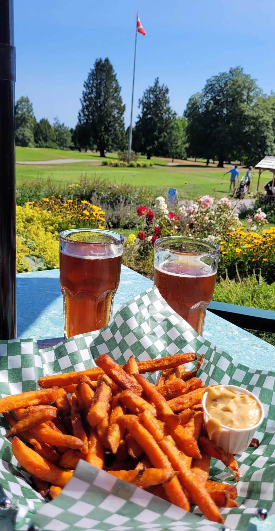 Post-round perfection: crispy yam fries, cold beer, and a view of the 18th green at Langara. Golf might be hit or miss, but this combo always scores. Post-round perfection: crispy yam fries, cold beer, and a view of the 18th green at Langara. Golf might be hit or miss, but this combo always scores.