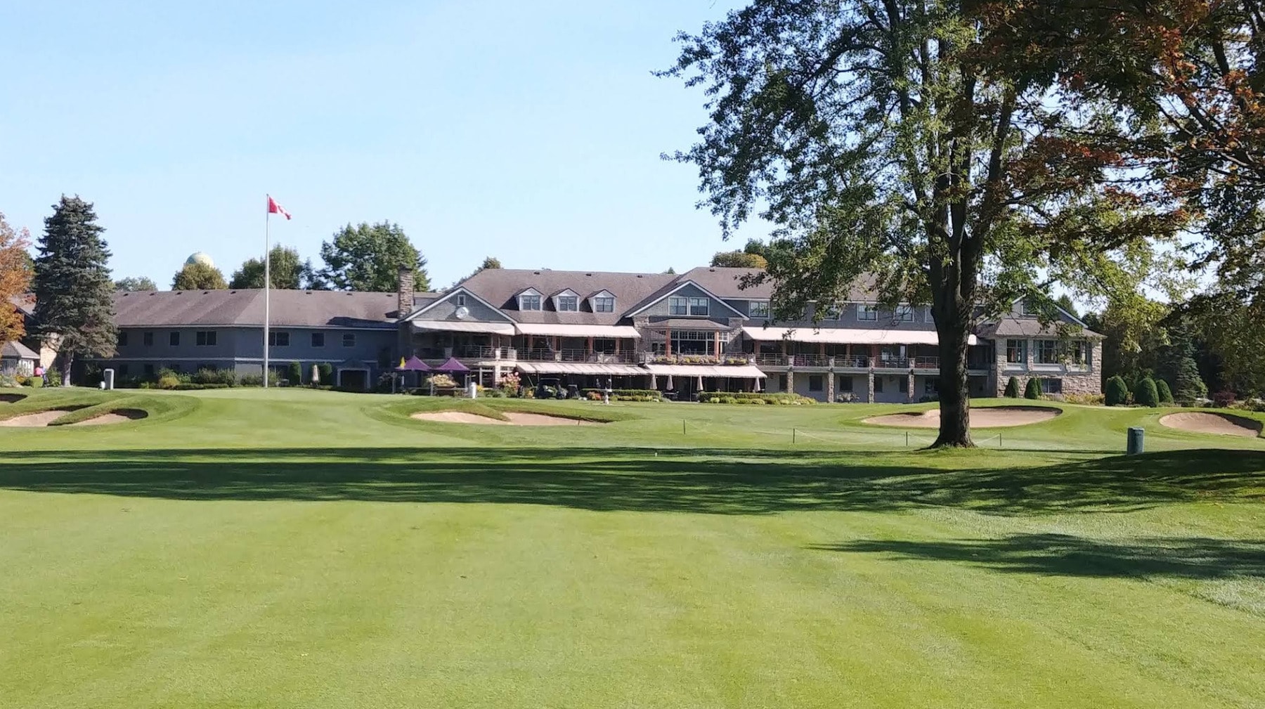 The clubhouse at The Royal Montreal Golf Club, a timeless landmark overlooking the final green and symbolizing over a century of golfing tradition. The clubhouse at The Royal Montreal Golf Club, a timeless landmark overlooking the final green and symbolizing over a century of golfing tradition.
